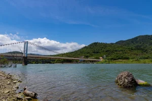 Suspension bridge against a blue sky, illustrating the best Base bridge options for moving crypto to Base