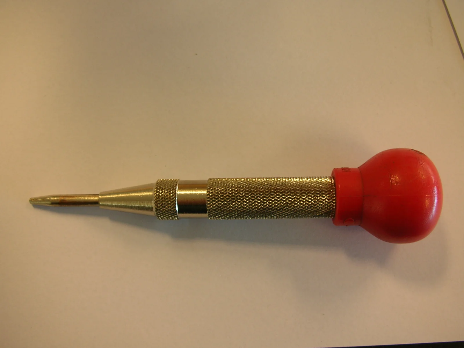 Automatic center punch, the tool used to mark a steel seed phrase backup plate