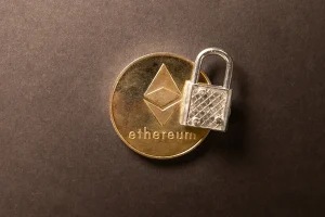Ethereum coin with a small padlock resting on it, illustrating a guide to the best wallets for DeFi