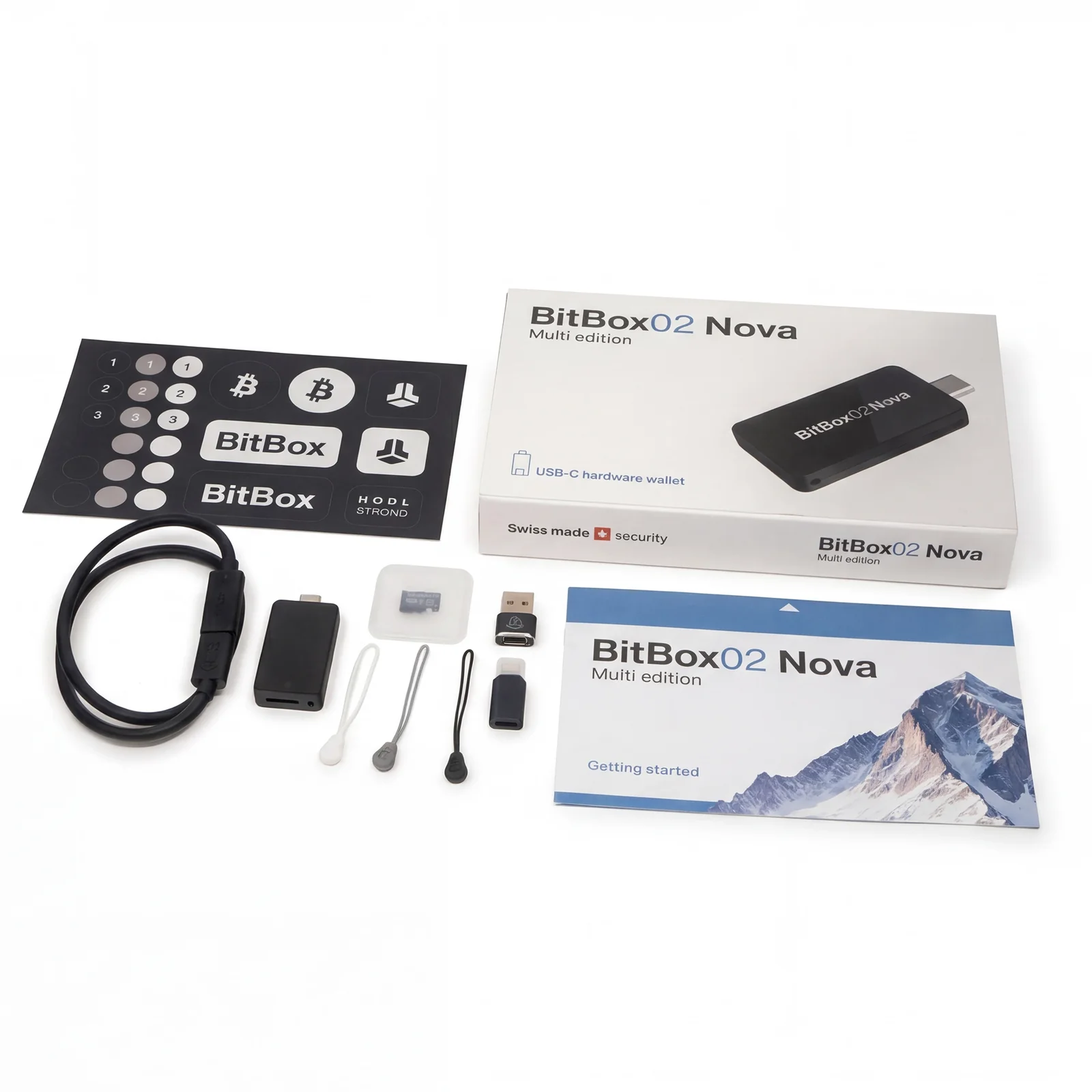 BitBox02 Nova Multi edition box contents: the device, microSD card, USB-A and Lightning adapters, extension cable, rubber pulls and stickers