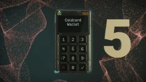 Coldcard Mk5 hardware wallet in its clear case with the Coldcard Wallet start screen and numeric keypad
