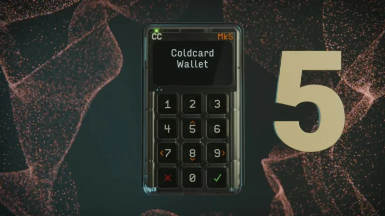 Coldcard Mk5 hardware wallet in its clear case with the Coldcard Wallet start screen and numeric keypad