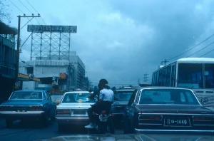 Cars and a motorbike stuck in a traffic jam, a picture of a stuck Ethereum transaction waiting in the mempool