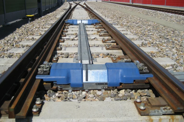 Railroad switch where one track splits into two, illustrating how to choose the right network when sending crypto