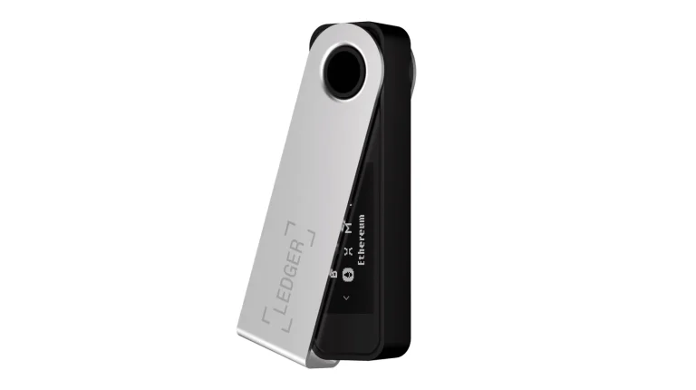 A Ledger Nano S Plus hardware wallet with its steel cover swivelled open, showing the small OLED screen