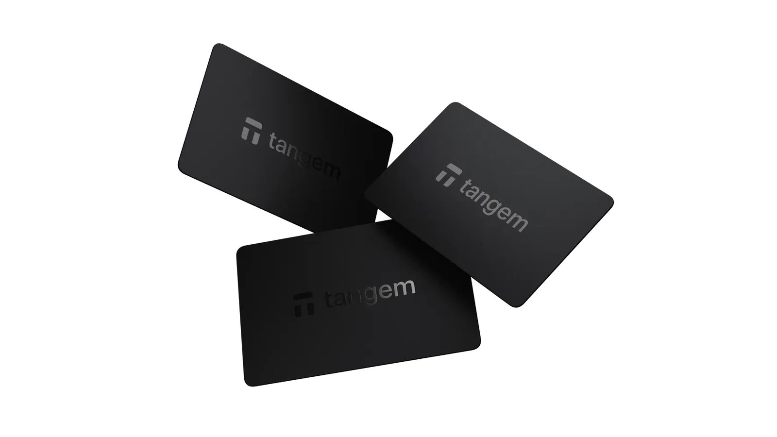 Three black Tangem Wallet cards from the 3 Cards Set on a white background