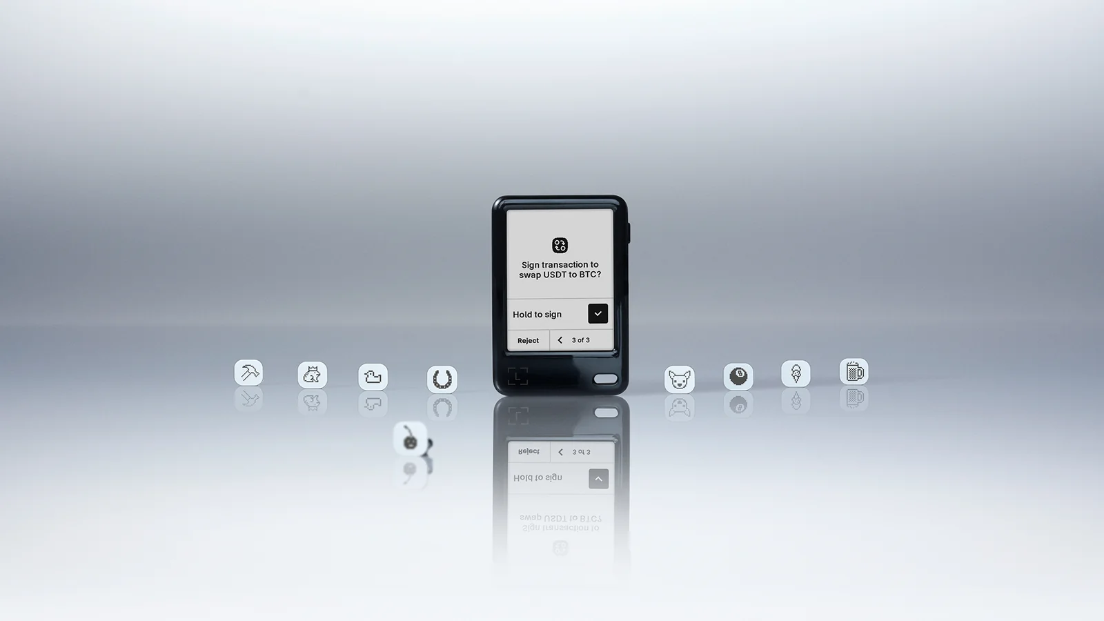 Ledger Nano Gen5 hardware wallet showing a swap confirmation on its E Ink touchscreen, surrounded by Susan Kare badges