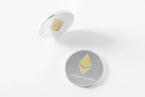 Two silver Ethereum coins on a white background, standing for the Ethereum network that both Polygon and Base connect to