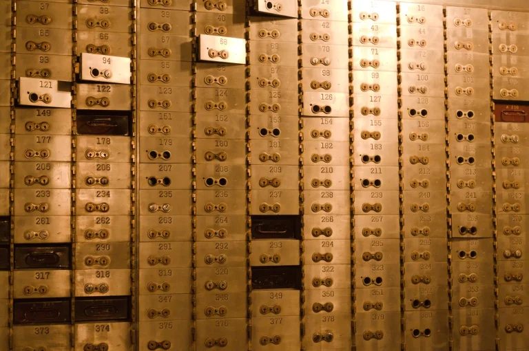 Rows of numbered safe deposit boxes, a picture of the Shamir backup idea of keeping separate shares in separate places